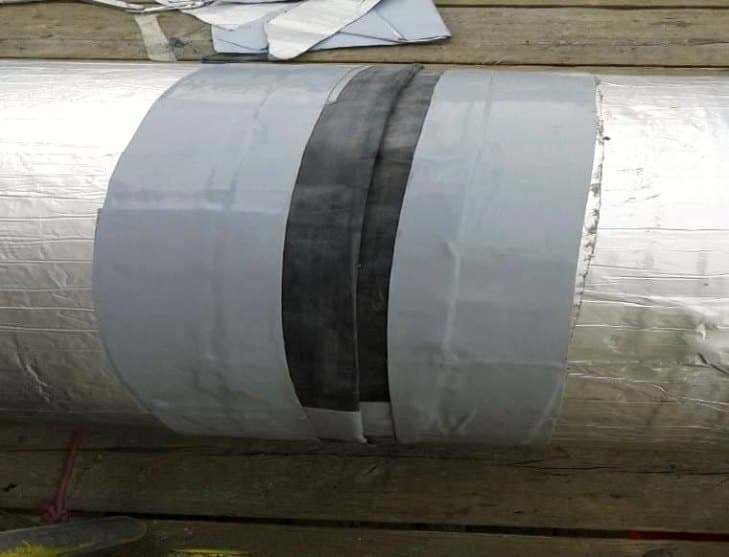 Securement banding and sealing tape applied over pipe insulation