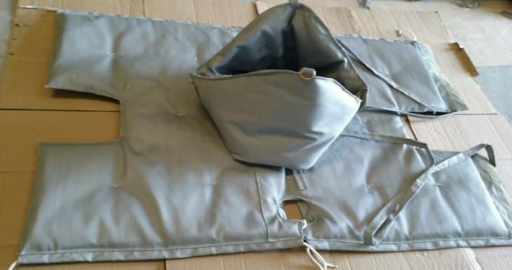 Removable insulation jacket laid flat showing hook-and-loop closures