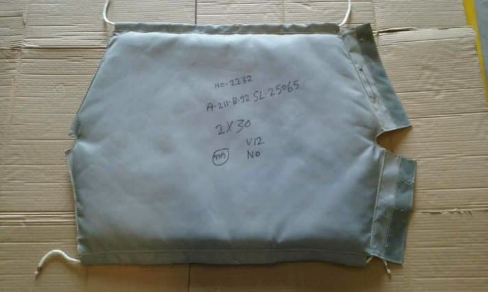 Fabricated jacket tagged with its identification label before storage